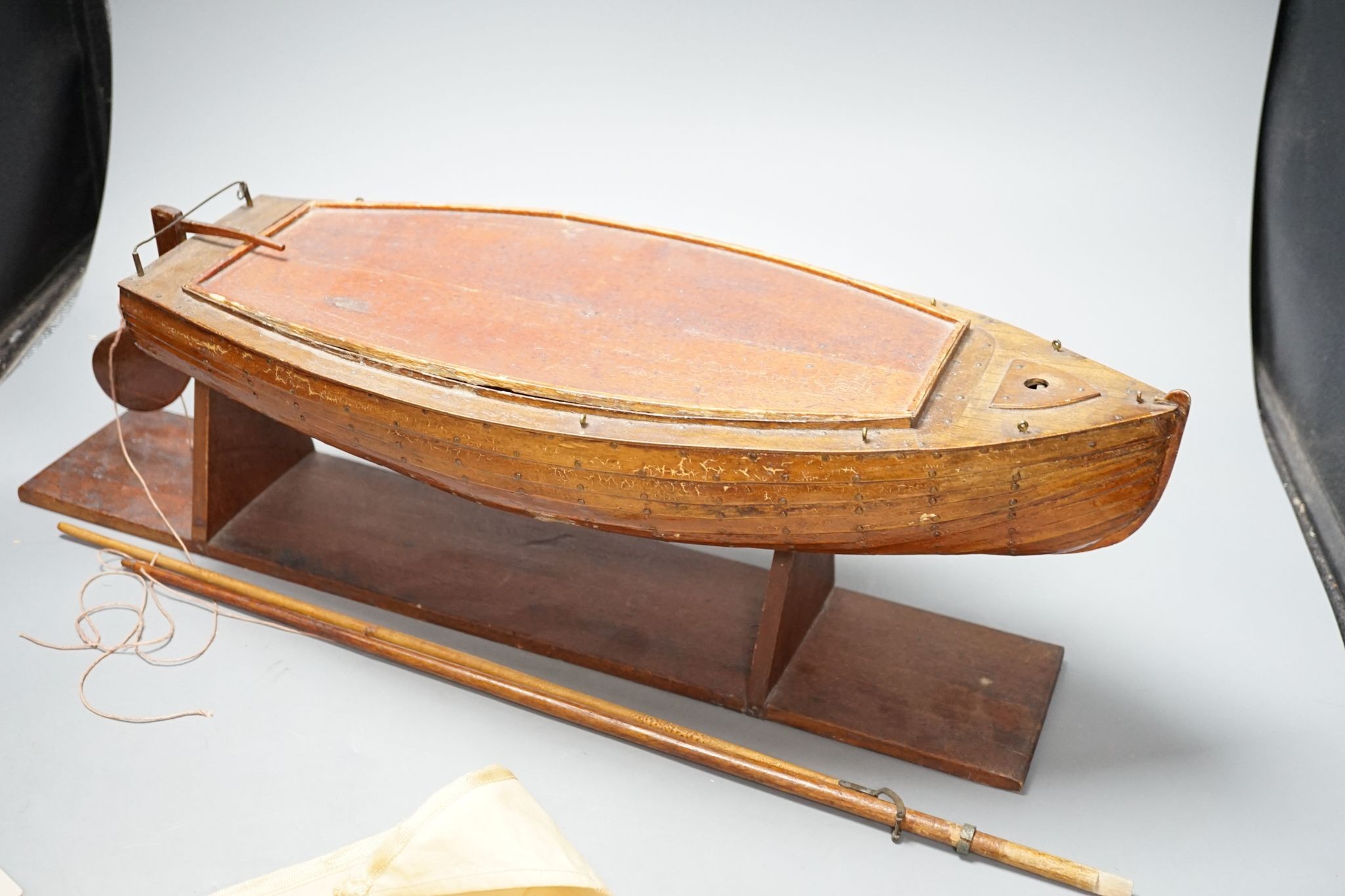 A pond yacht, on stand, 46cm excluding rudder and stand